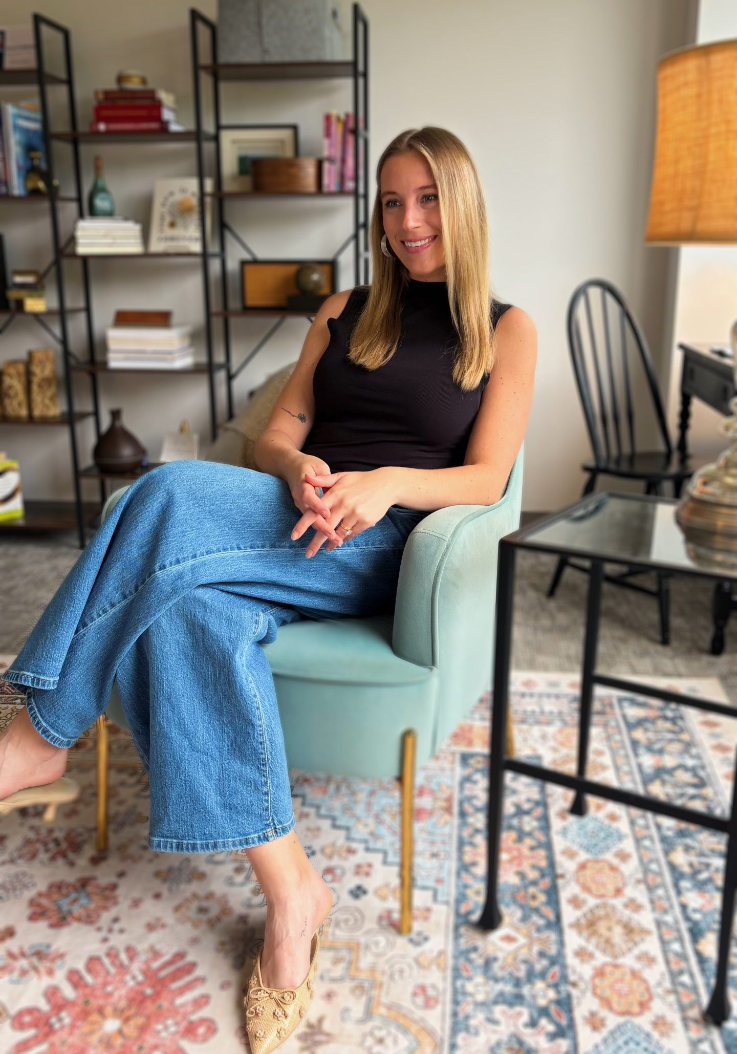 therapist facing to the left sitting on chair